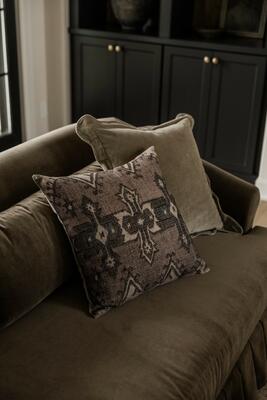 Propped on the Hank sofa, pillows deliver just the right amount of pattern and color to a room