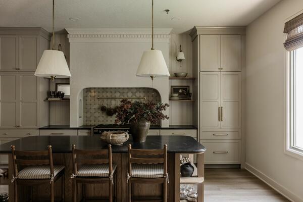 Declan counter stools shown in the dark oak finish and paired with Diane pendants