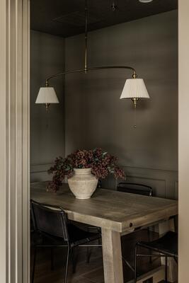 Diane linear chandelier in the brass finish option with a linen shade